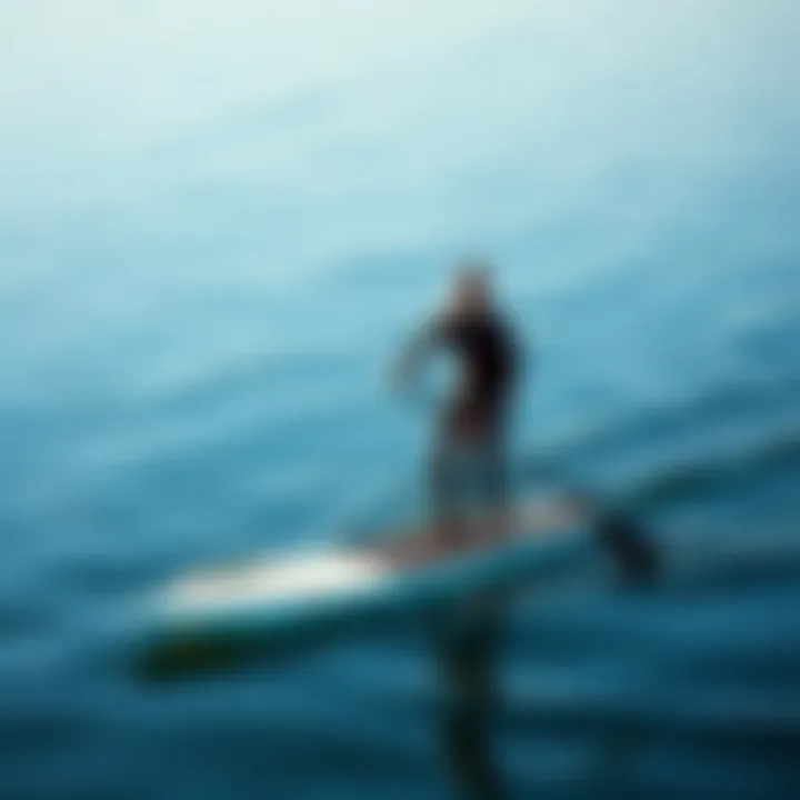 Paddleboarding with the Right Insulation Paddleboarder in a wetsuit on calm waters