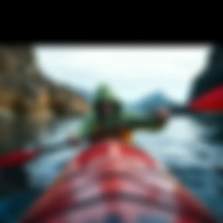 A watersport enthusiast wearing the Patagonia Light Hoodie during a kayaking session