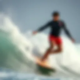 Surfer demonstrating pumping technique on a wave
