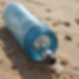 Close-up of a water bottle on a beach