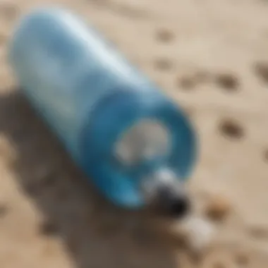 Close-up of a water bottle on a beach