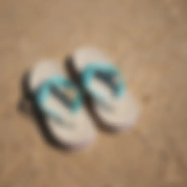 Stylish Reef Newport flip flops on a sandy beach