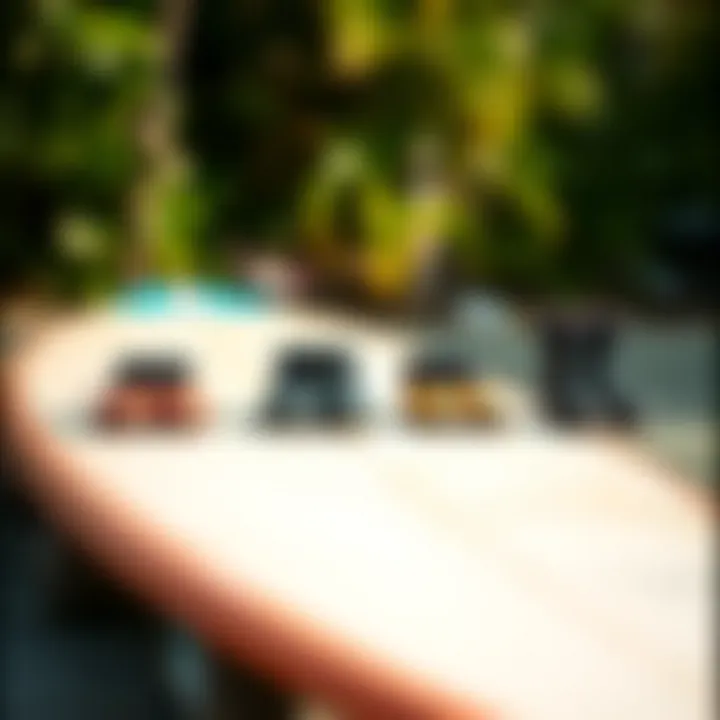 Comparison of different sizes of Ripcurl booties laid out on a surfboard