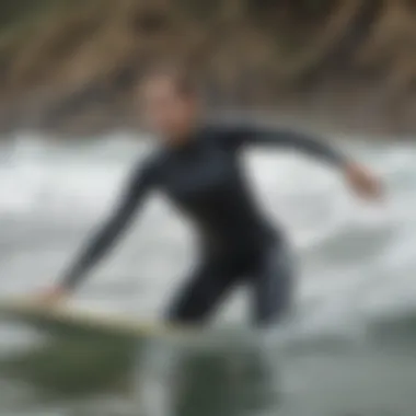 Athlete wearing RVCA wetsuit top during a surf session