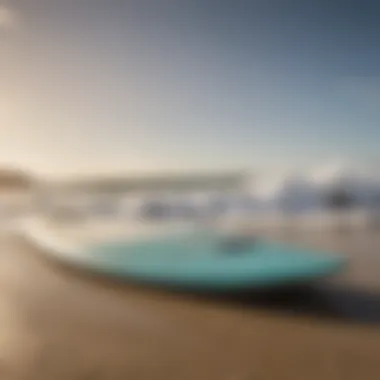 Close-up of a surfboard on the beach with waves in the background