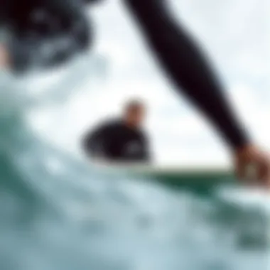 Surfer Enjoying Optimal Performance Surfer in a wetsuit riding a wave