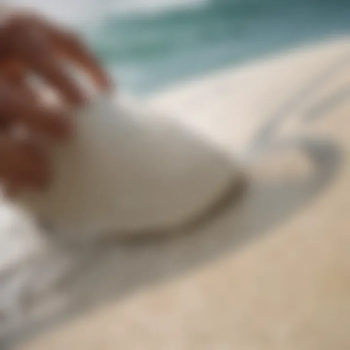 Close-up of surf paste application on a surfboard