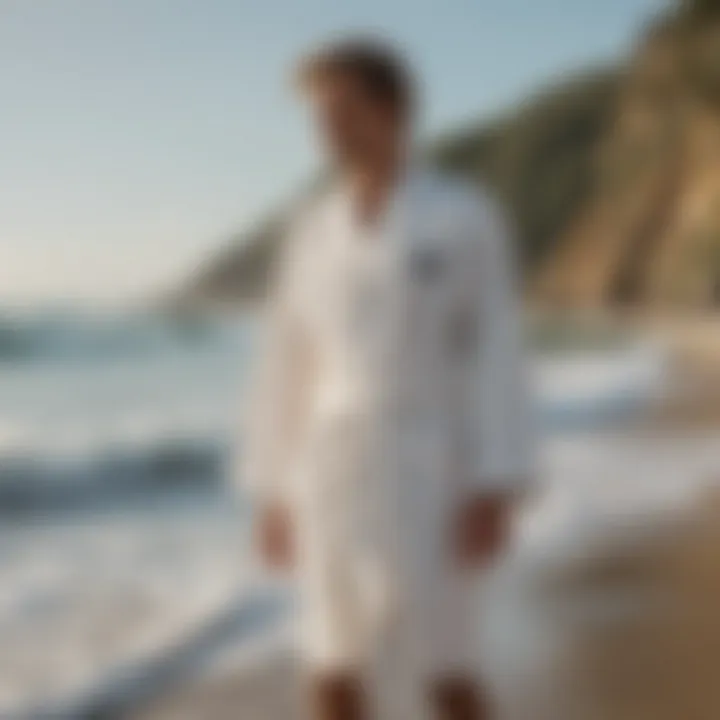 A surfer wearing a robe post-session on the shore