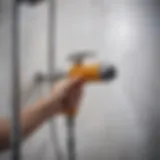 Close-up of a compact hand pump shower with adjustable nozzle