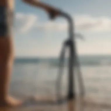 Outdoor scene illustrating the use of a hand pump shower at a beach