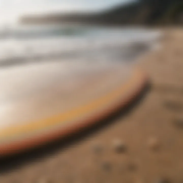 Close-up of the skimboard on a sandy beach