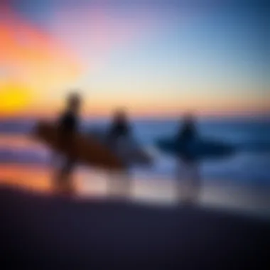A group of surfers enjoying the sunset on the beach