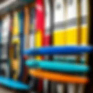 A variety of paddleboards arranged neatly on a display rack.