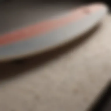 A close-up view of a foam top longboard showcasing its textured surface and construction materials.