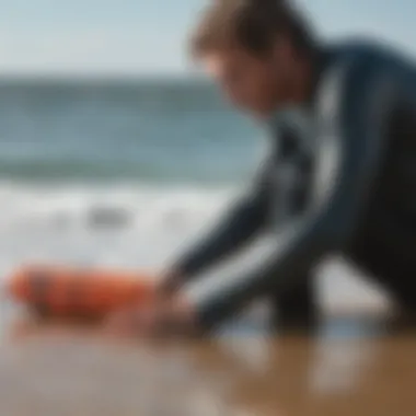 Surfer maintaining their mittens after use