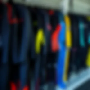 Diverse Range of Wetsuits Available Variety of wetsuits displayed on a rack