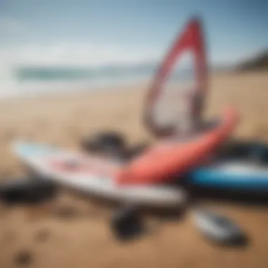 Windsurfing equipment laid out on the beach