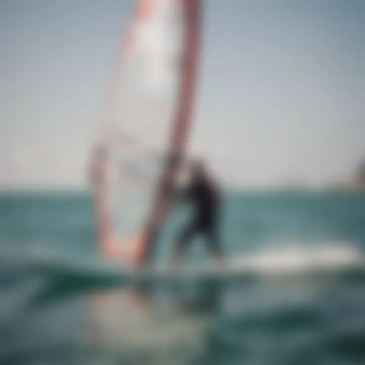 Instructor providing guidance to a beginner windsurfer